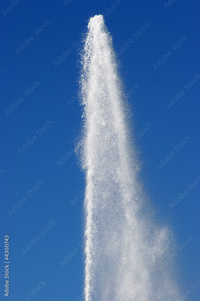 water geyser against a bright blue sky water geyser against a bright blue sky