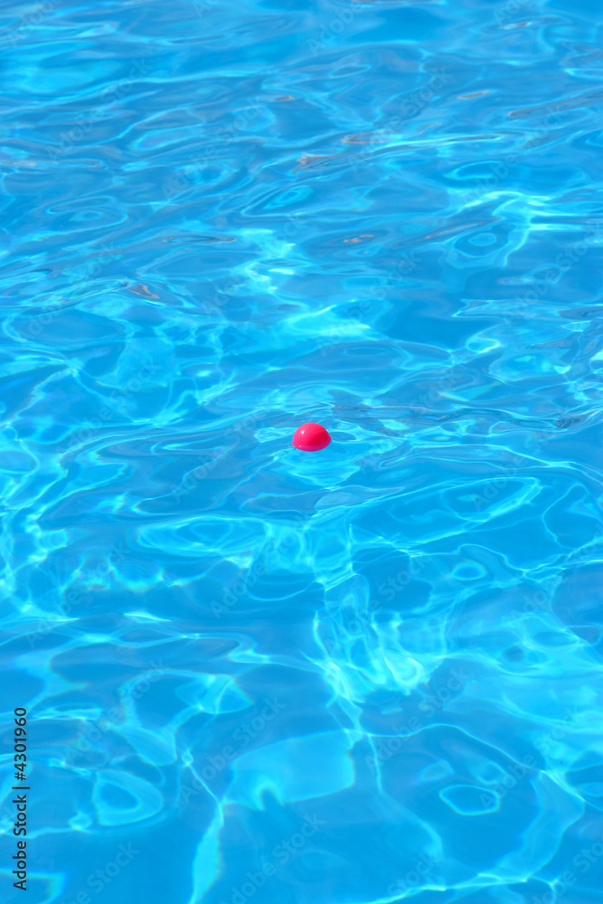 pool water with a pink ball in the middle
