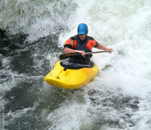 Man Paddling his Kayak on Whitewater Rapids © Chris Lofty