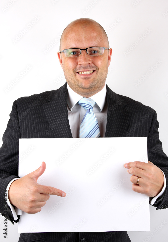 Businessman pointing at blank sign Businessman pointing at blank sign