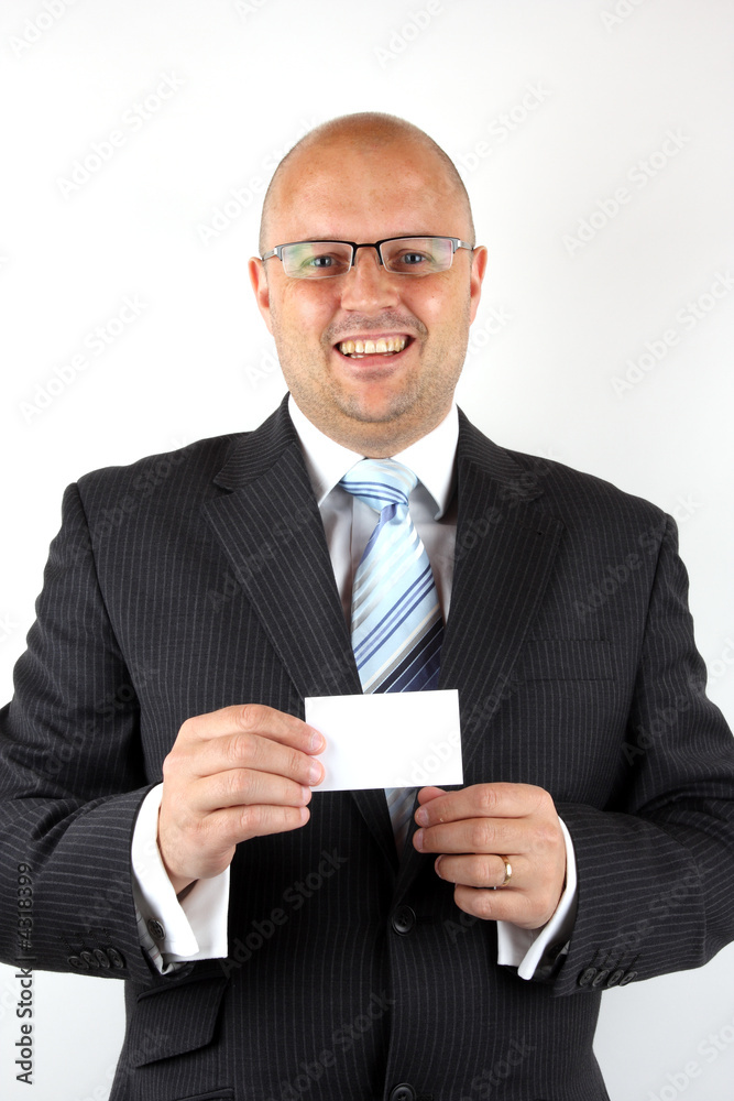 Cheerful businessman holding a business card Cheerful businessman holding a business card