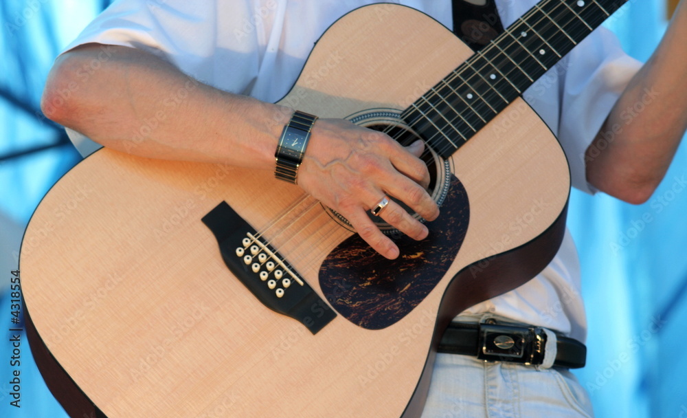 Naklejka premium Hand and guitar