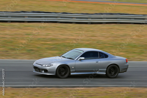 Speeding sports car on a race track © benng