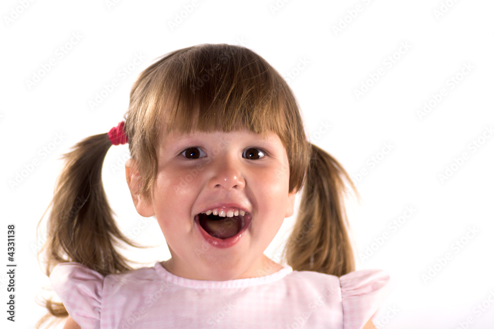 Excited laughing little girl with ponytails isolated on white Excited laughing little girl with ponytails isolated on white