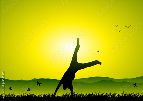 Happy boy having fun at sunset