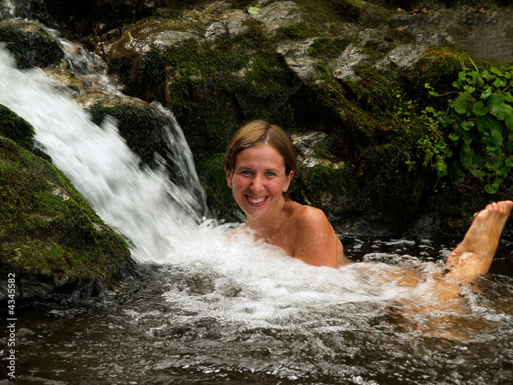 laughing girl bathing in the forest waterfall laughing girl bathing in the forest waterfall