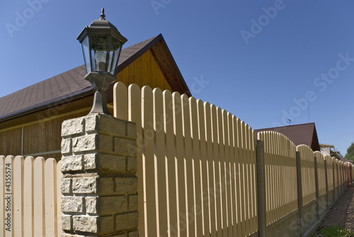 Fotografie, Obraz Fence near new houses.