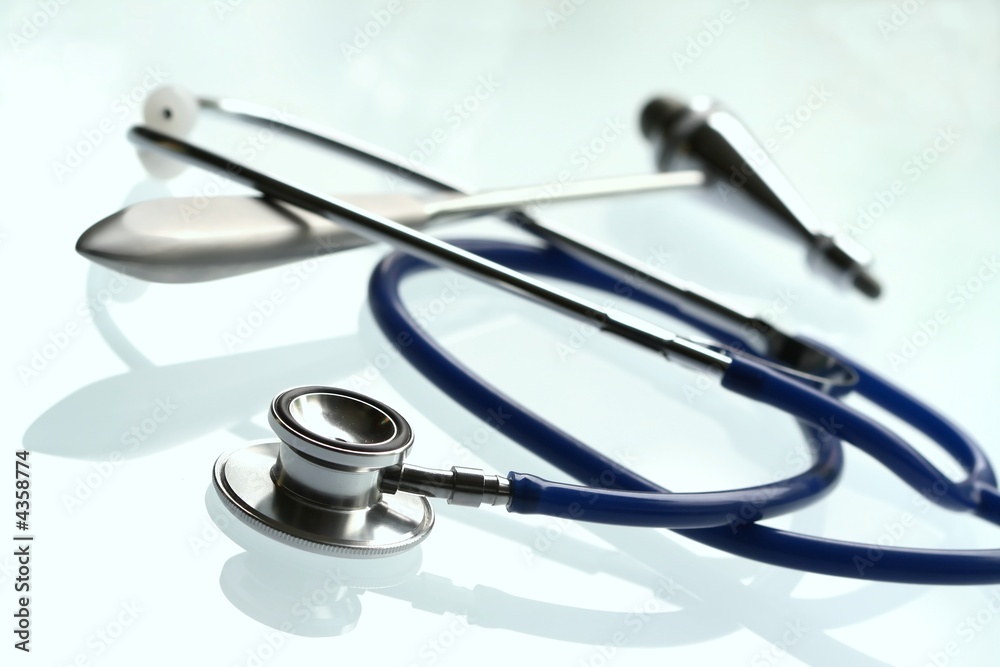 A shallow DOF image of a stethoscope on white background. A shallow DOF image of a stethoscope on white background.