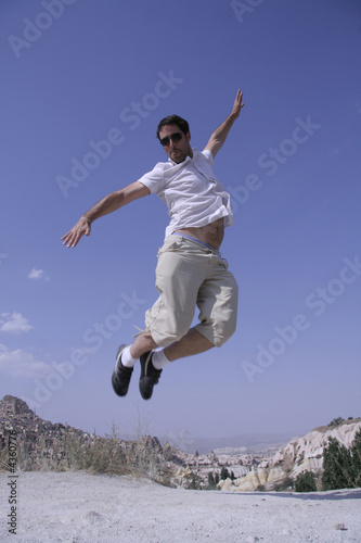 healthy happy man jumping in joy of life © paul prescott