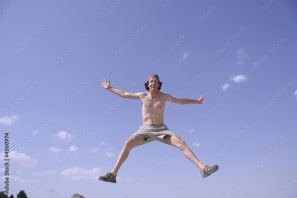 healthy happy man jumping in joy of life