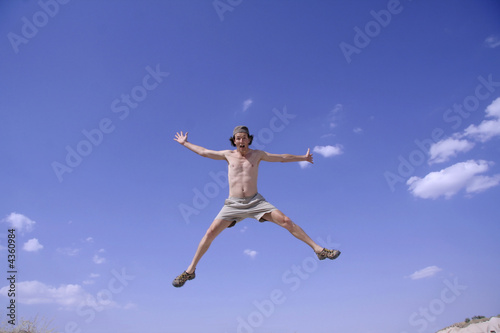 healthy happy man jumping in joy of life