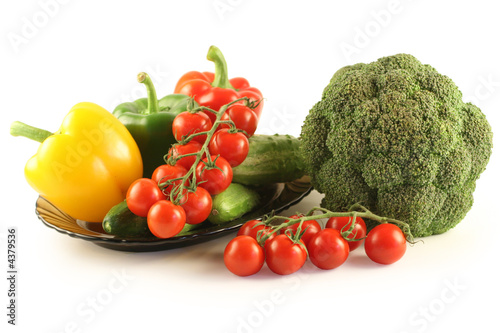 Broccoli,cucumbers, pepper and tomatoes on a plate 