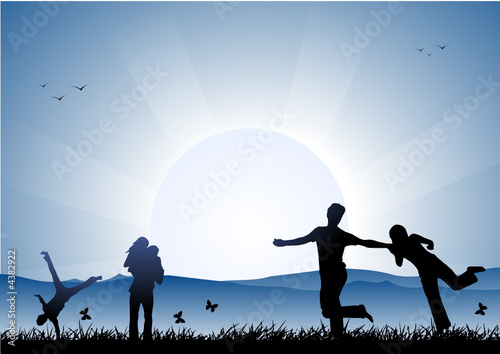 Happy friends at sunset