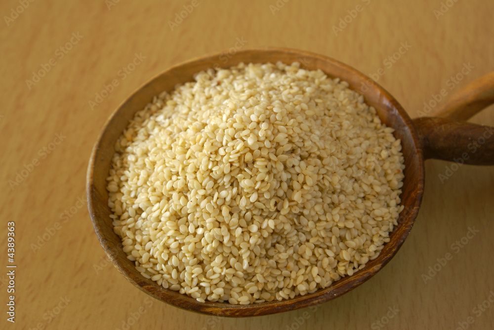 Sesame seed on the wooden spoon from South Africa Sesame seed on the wooden spoon from South Africa