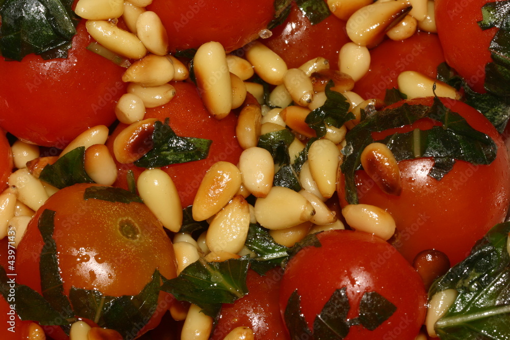 Photo of the tomatoes and cedar seeds salad Photo of the tomatoes and cedar seeds salad