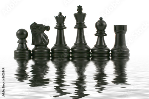 Black Chess pieces with water reflection