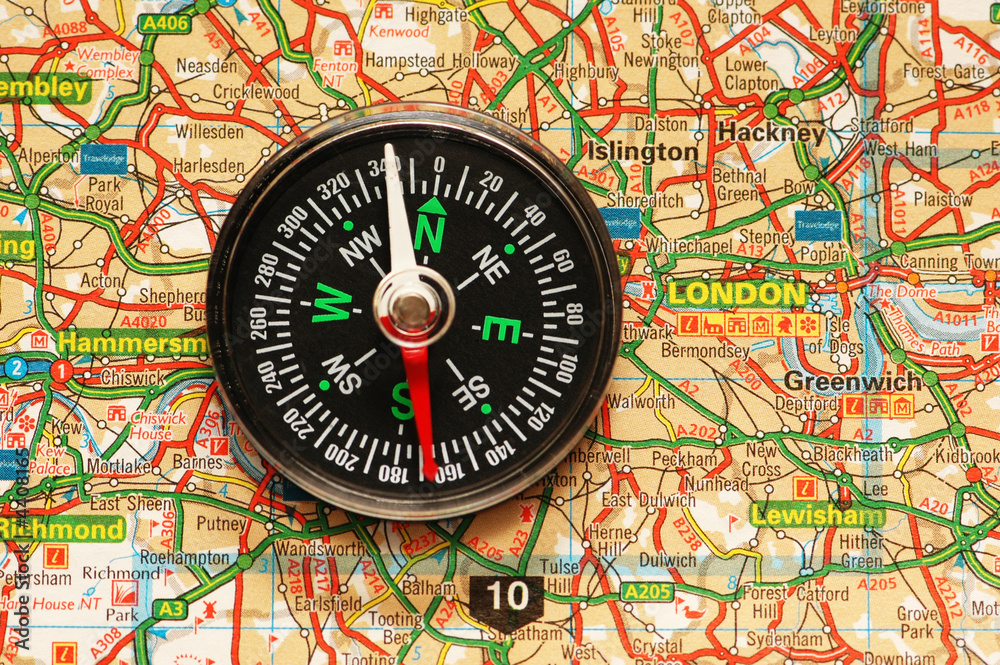 Compass over the map of UK - London suburbs