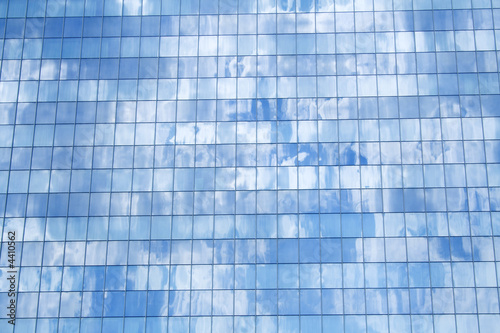 Glass facade building detail reflecting sky