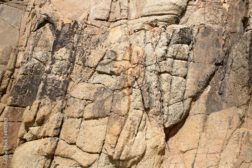 Large cliff face background.
