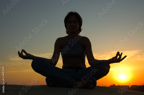 Fototapeta Naklejka Na Ścianę i Meble -  Woman silhouette making yoga