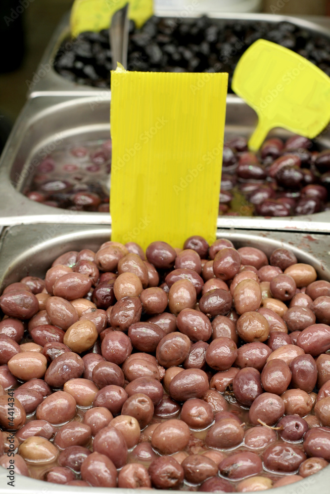 olives in oil on display in market olives in oil on display in market