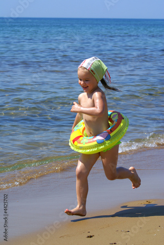 girl runs on a beach