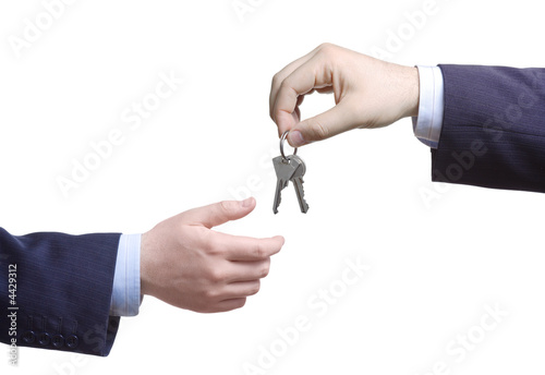 Person passing door keys 