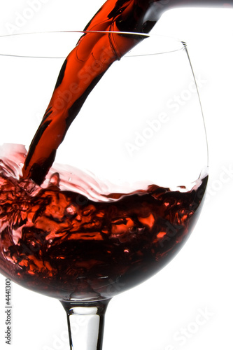 Wine pouring into glass from decanter