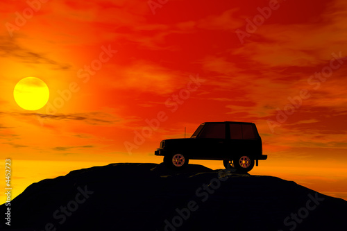 jeep with sunet behind photo