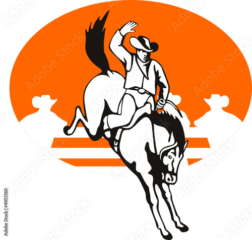 Cowboy riding a bucking bronco