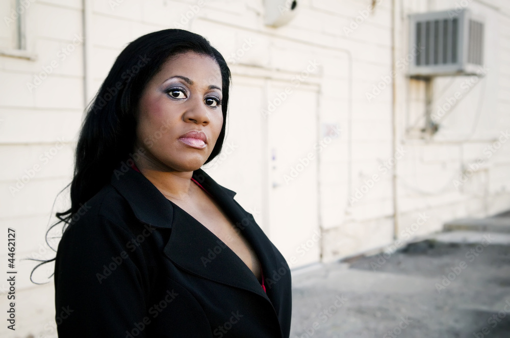 Fototapeta premium African American Business Woman by Industrial Building