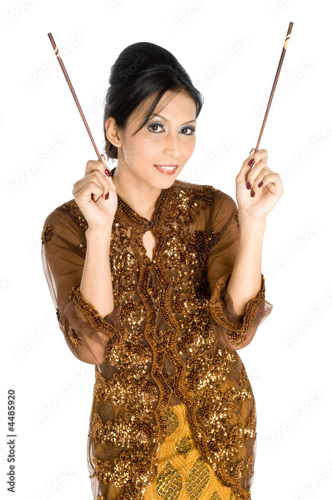 Beautiful asian girl playing with chopsticks Beautiful asian girl playing with chopsticks