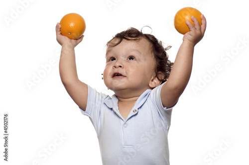 The child with oranges.