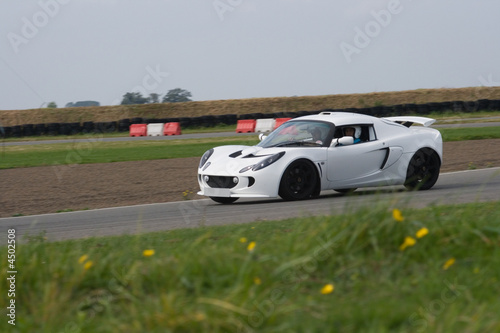 White sports car on racing circuit