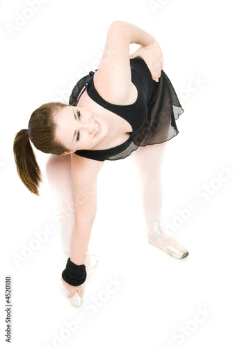 A young girl stretching