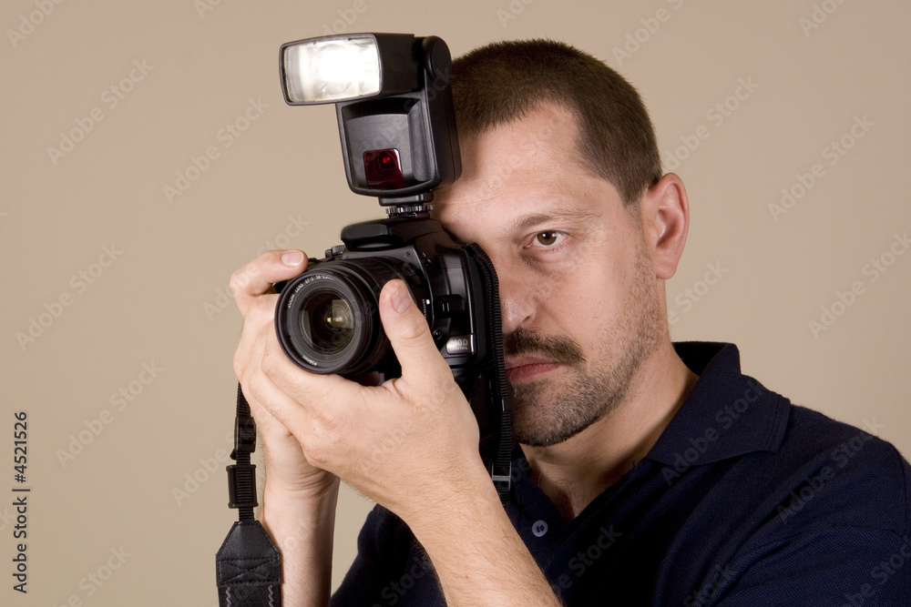 man with digital camera
