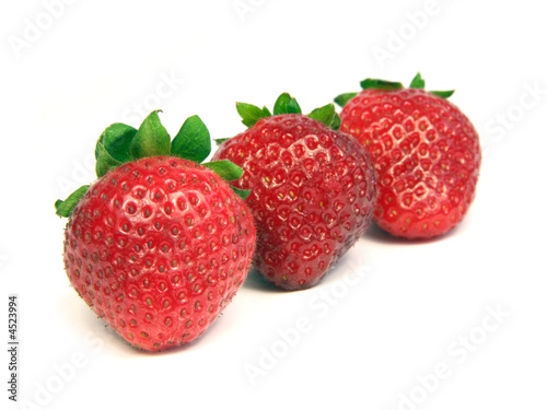 Three strawberries isolated on white background.