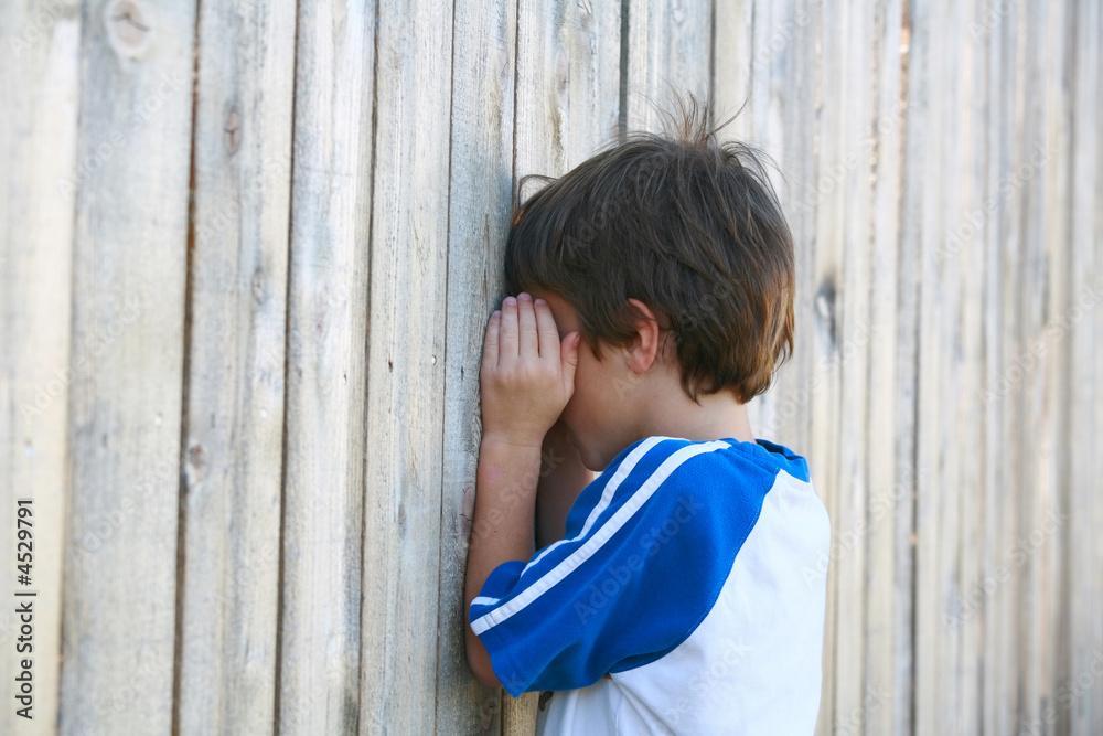 Fototapeta premium Boy Playing Hide and go Seek