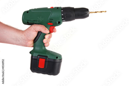 Man's hand holding cordless power drill - isolated on white