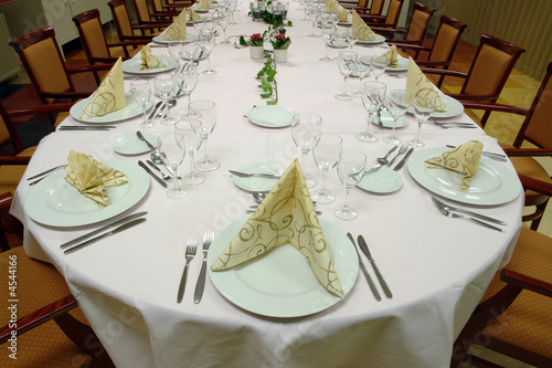 large dinner table set up for a lot of people