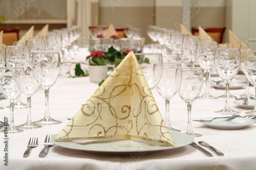 large dinner table set up for a lot of people
