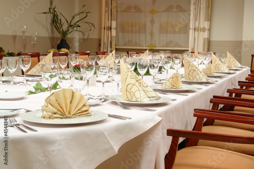 large dinner table set up for a lot of people
