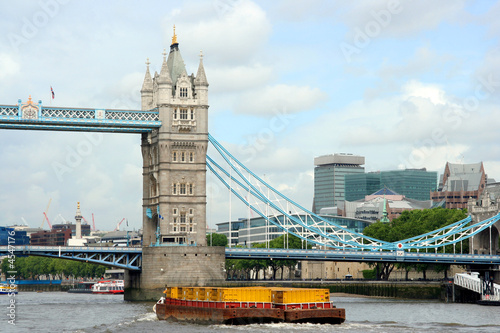 London skyline with Tower Bridge and Thames barges photo