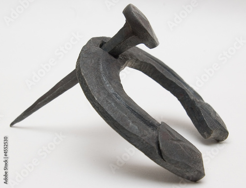 Nail and horseshoe