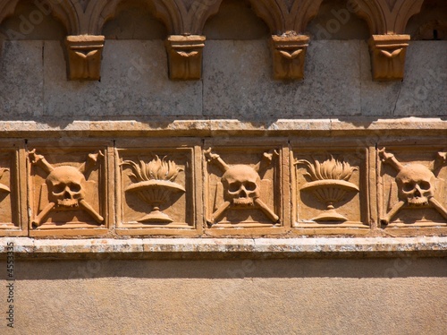 Caltagirone skull crossbones and fire of the cemetery monumental photo