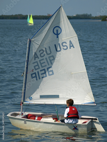 Young boy in a sailboat.