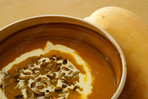 Butternut squash soup with grilled sunflower seed photo
