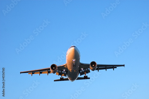 Wide body airliner in blue sky
