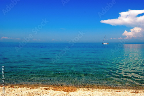 distant yacht blue sea 
