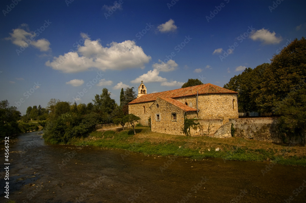 French countryside village church blue sky river